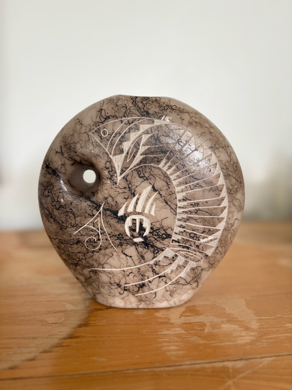 Signed Ejay Navajo horsehair pottery vase with etched fish and bear paw designs.